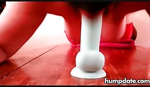 Babe sucks her dildo